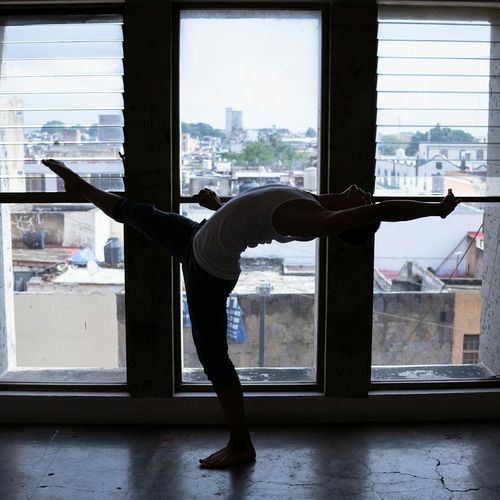 Person in a dynamic and flexible yoga flow.