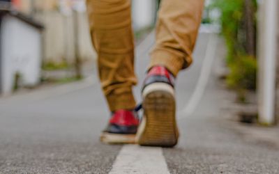 Person taking the first step on a journey path.