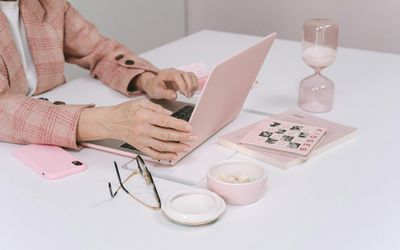 Person working at a modern desk setup.